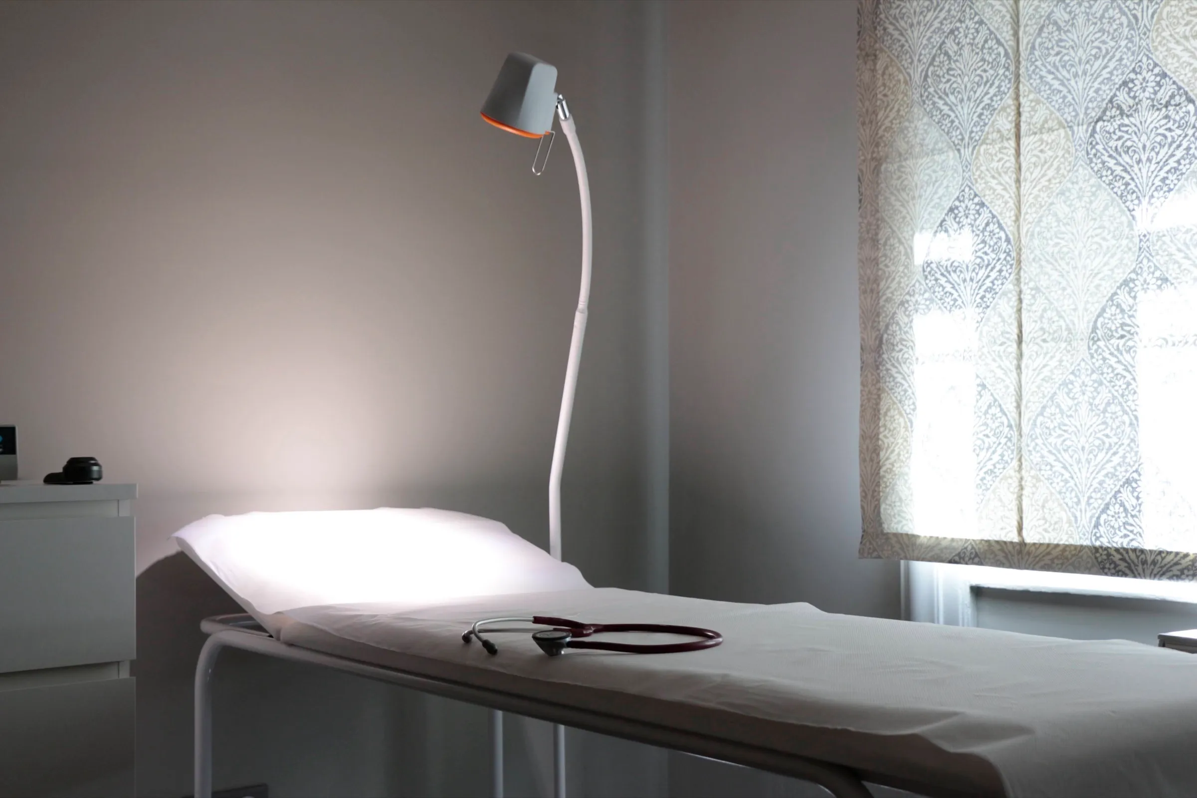 An examination couch in the practice, in a bright, friendly room